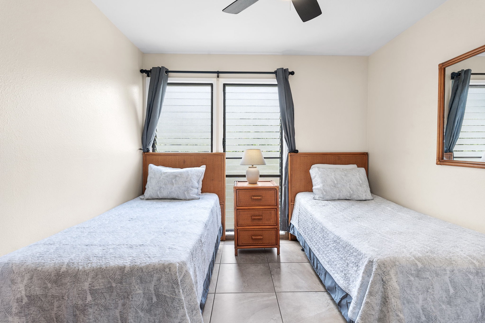 Kailua Kona Vacation Rentals, Sea Village 4213 - Bright and breezy guest bedroom with cozy twin setup and garden views—ideal for a restful night's sleep.