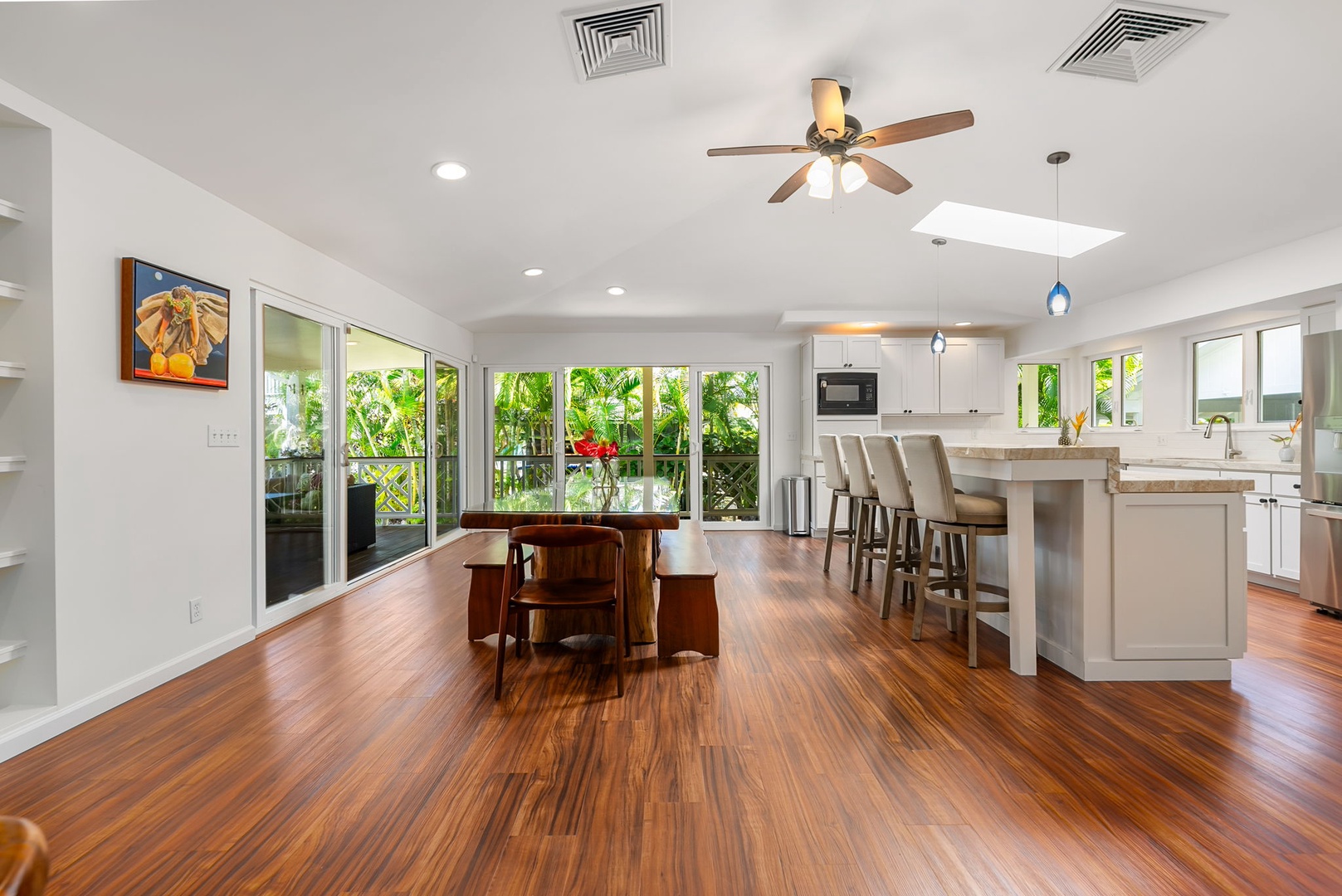 Kailua Vacation Rentals, Nohie Lanikai - An inviting space to enjoy meals together, with views of lush greenery just outside.