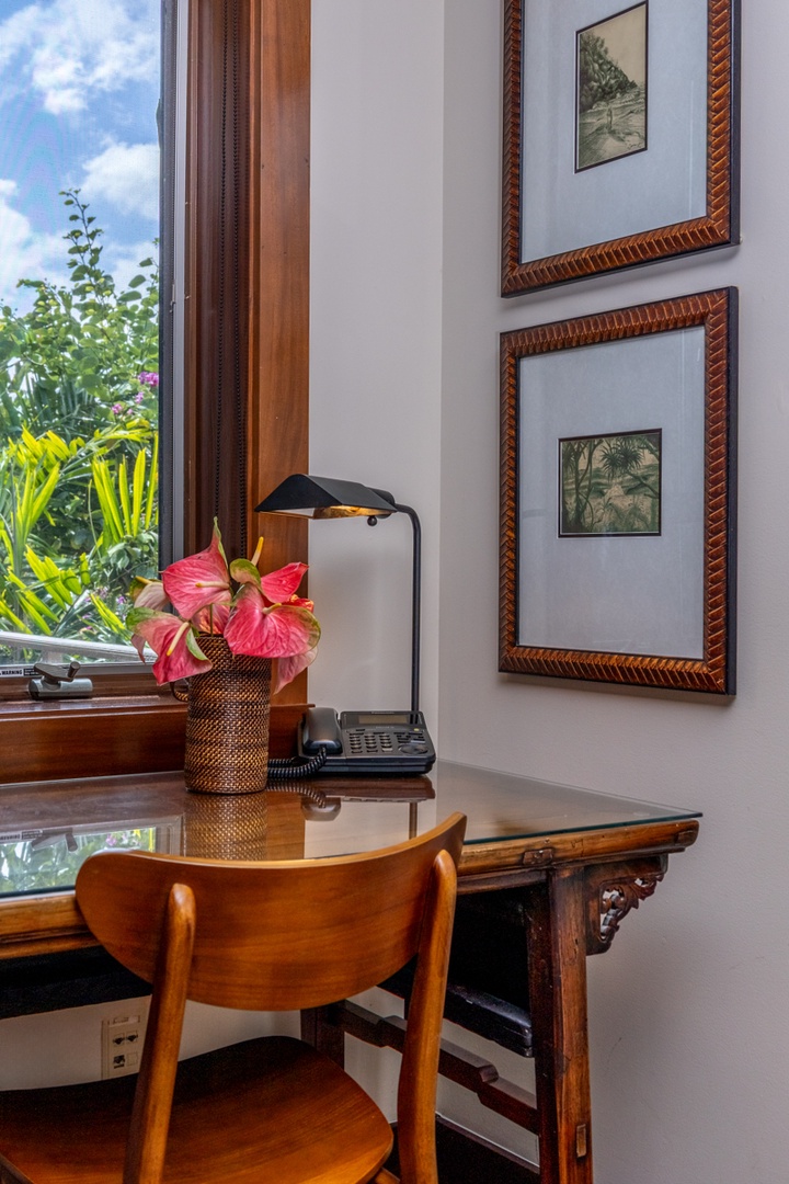 Kailua Kona Vacation Rentals, Fairways Villa 120A - Your elegant workspace features a polished wooden desk with garden views, perfect for productive mornings with tropical blooms brightening your day.