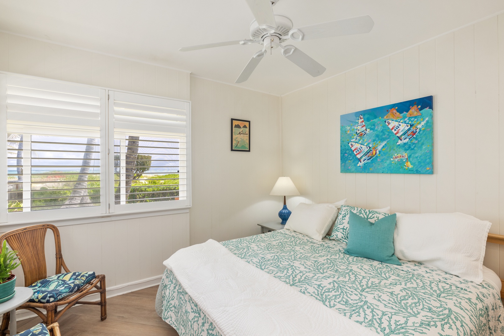 Kailua Vacation Rentals, Hale Moana Lanikai - Retreat to this tranquil king-sized bed adorned with fresh, ocean-inspired linen, equipped with a ceiling fan to ensure a cool and restful sleep