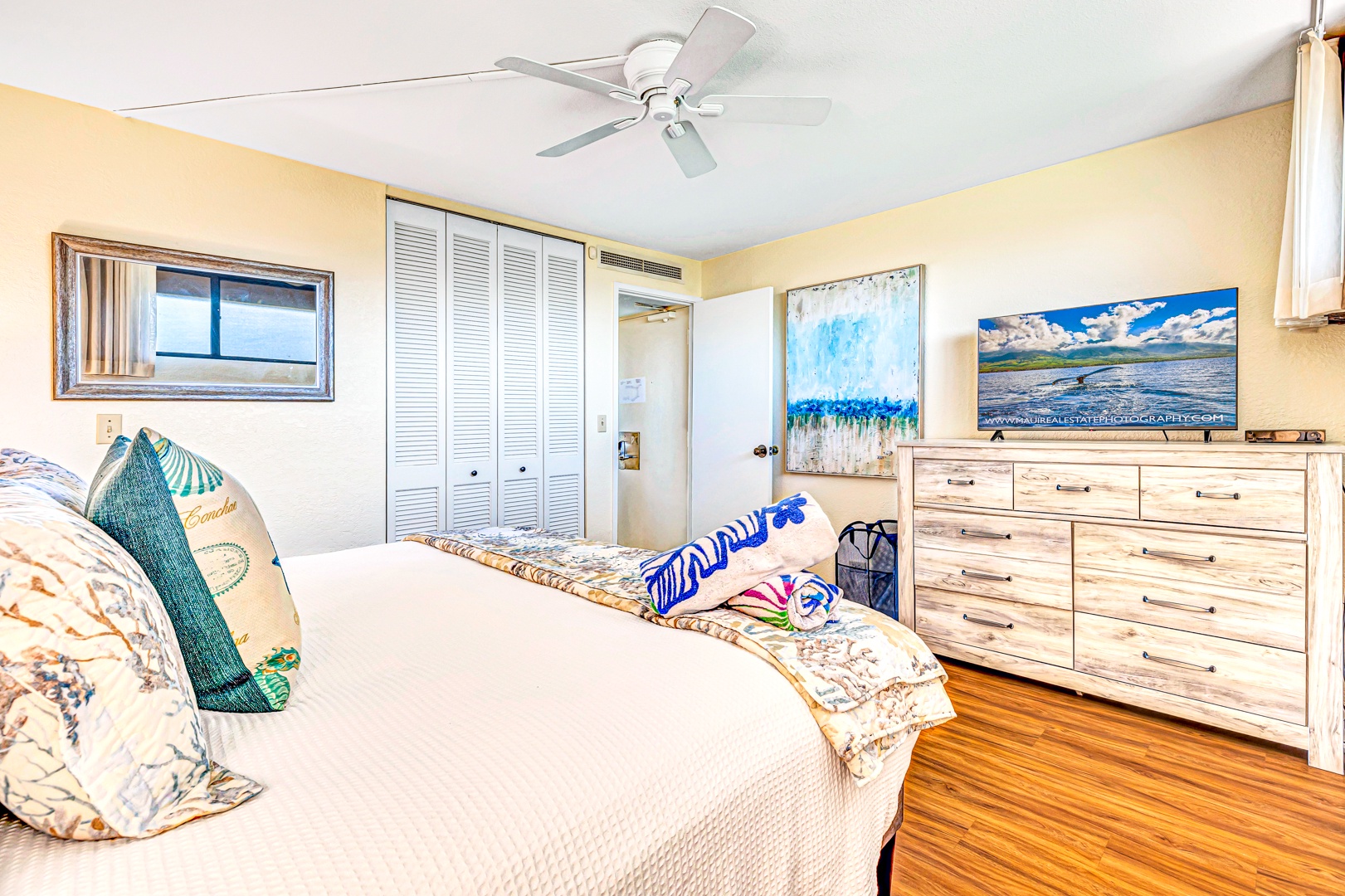 Lahaina Vacation Rentals, Kaanapali Shores 746 - The bedroom features ample closet space, a flat-screen TV, and a king-sized bed, creating a comfortable retreat for guests.