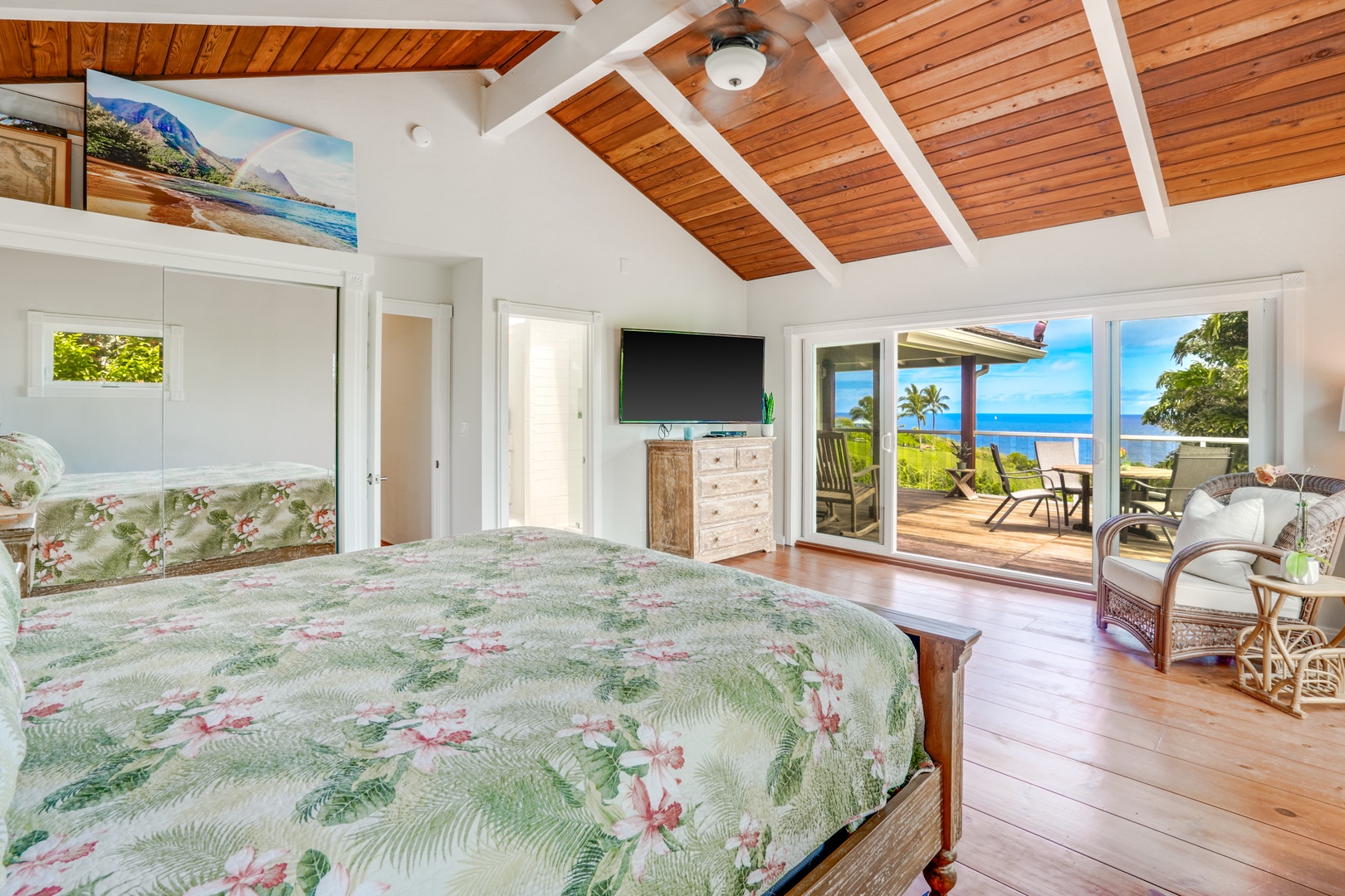 Princeville Vacation Rentals, Wai Lani - Spacious primary with wide sliding doors to private lanai with captivating panoramic ocean views.