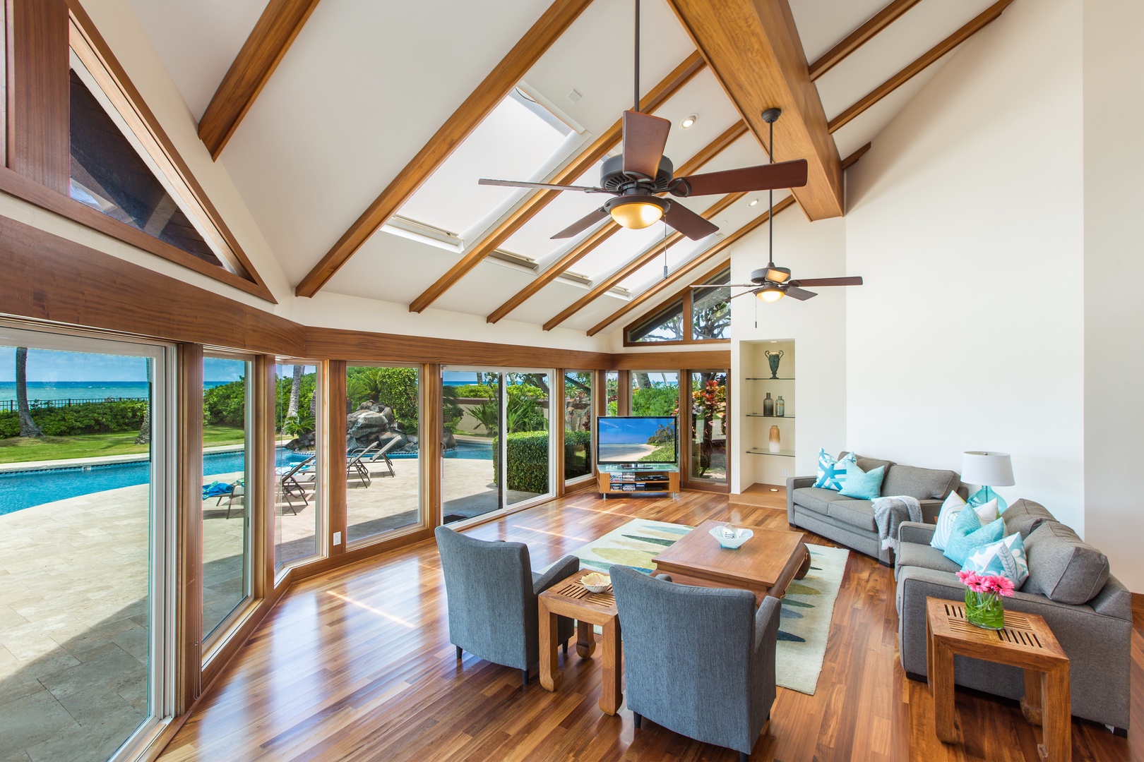 Honolulu Vacation Rentals, Kahala Mini Resort (5BR) - Vaulted open-beam ceilings rise over a living room that opens straight to the water.