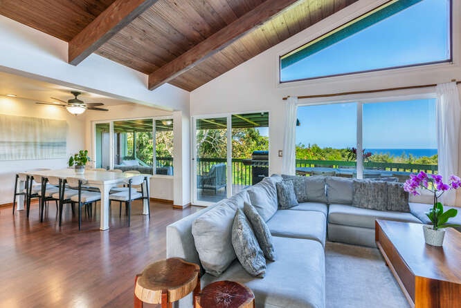 Princeville Vacation Rentals, Hale Ohia - The living area opens up to the deck through sliding glass doors.