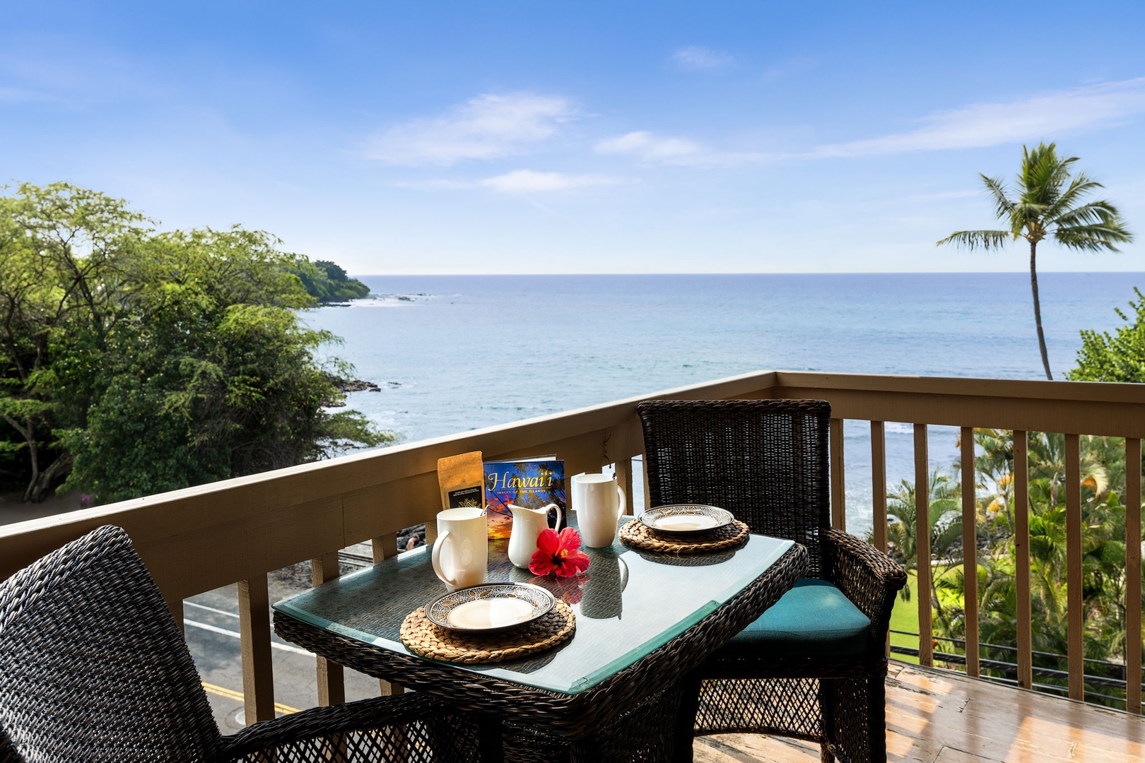 Kailua Kona Vacation Rentals, Royal Kahili 401A - Oceanfront breakfast on a private balcony with seating for two, offering stunning water views.