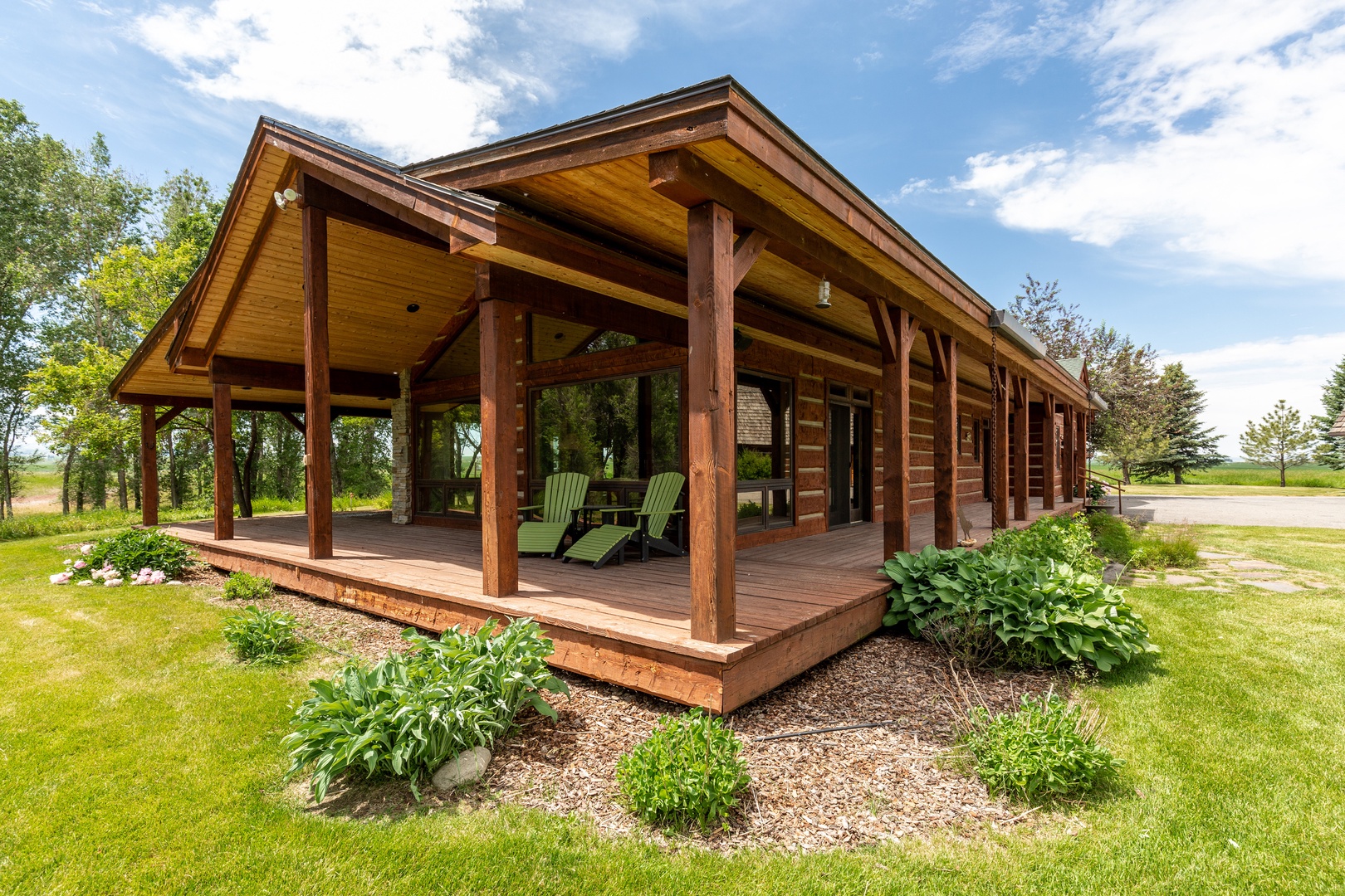 Bozeman Vacation Rentals, The Woodland Oasis - Covered patio with share for those warm summer days