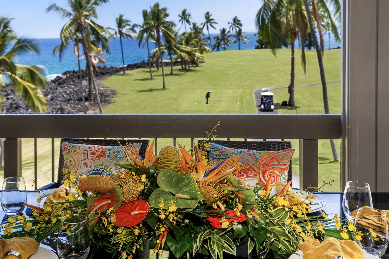 Kailua Kona Vacation Rentals, Kanaloa at Kona 1606 - A tropical arrangement on the rail, the fairway stretching green behind it.