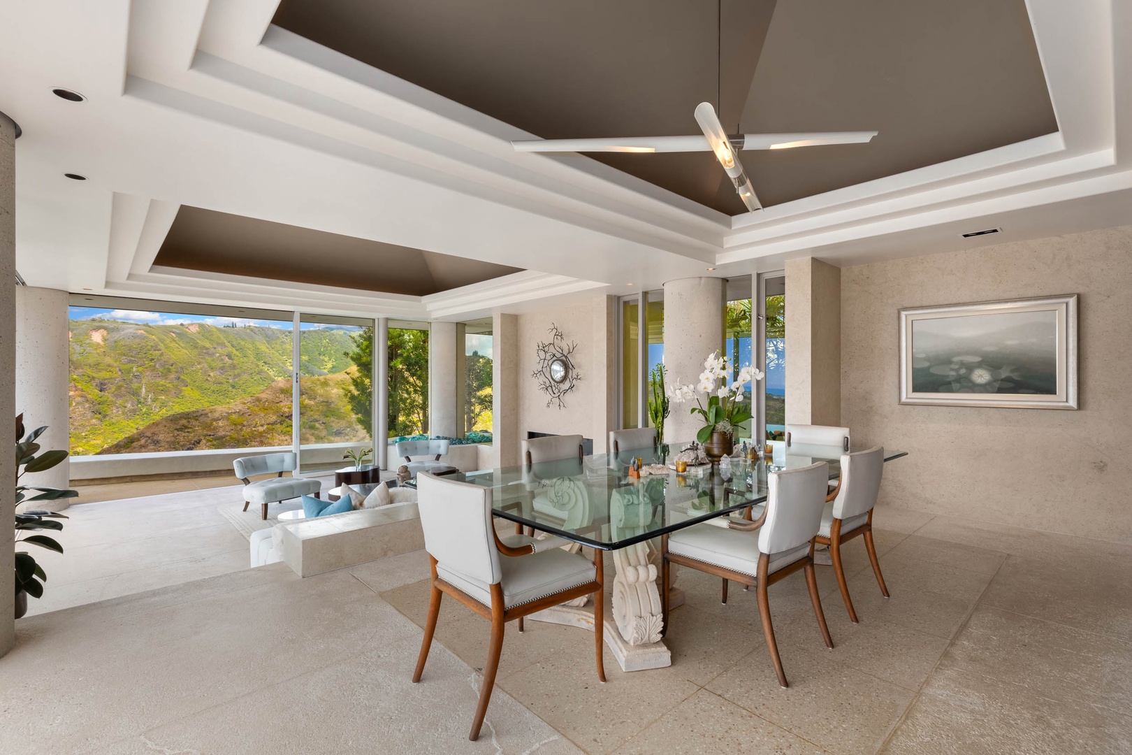 Honolulu Vacation Rentals, Sky Ridge House - Elegant glass dining table with sleek white chairs for six.