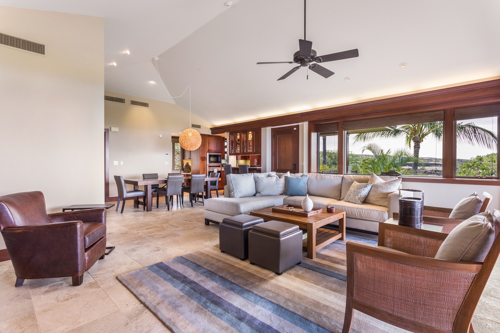 Kailua Kona Vacation Rentals, 3BD Hainoa Villa (2901D) at Four Seasons Resort at Hualalai - Living to dining room with big windows featuring expansive mountain views.