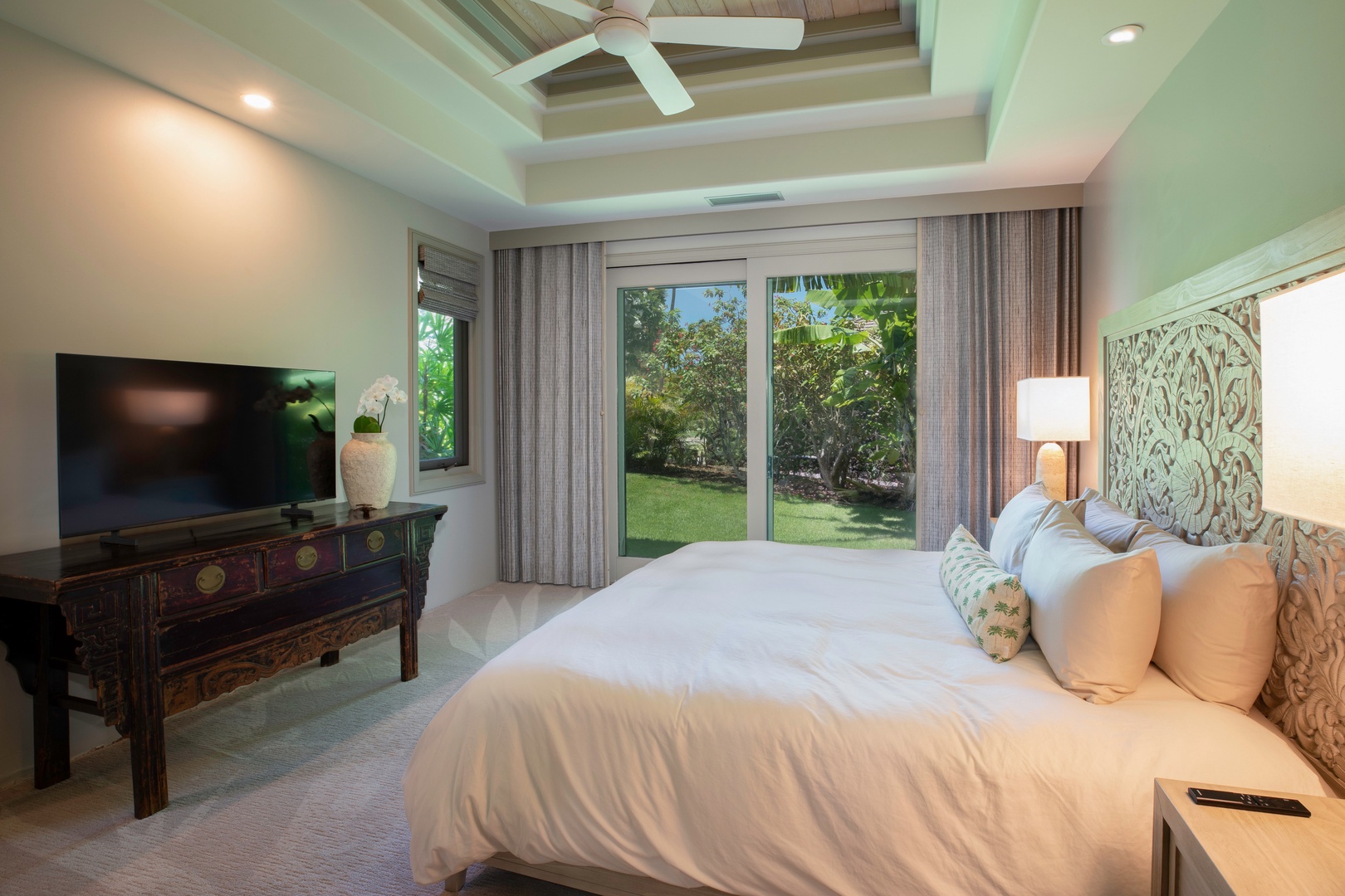 Kamuela Vacation Rentals, Canoe House at Champion Ridge - Bright, airy guest bedroom with easy access to the lanai — comfort meets island charm.