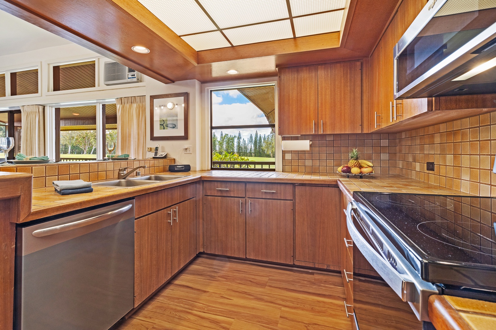 Lahaina Vacation Rentals, Kapalua Ridge 2321 - Take in ocean glimpses from the kitchen at Kapalua Ridge 2321, complete with rich cabinetry and modern design.
