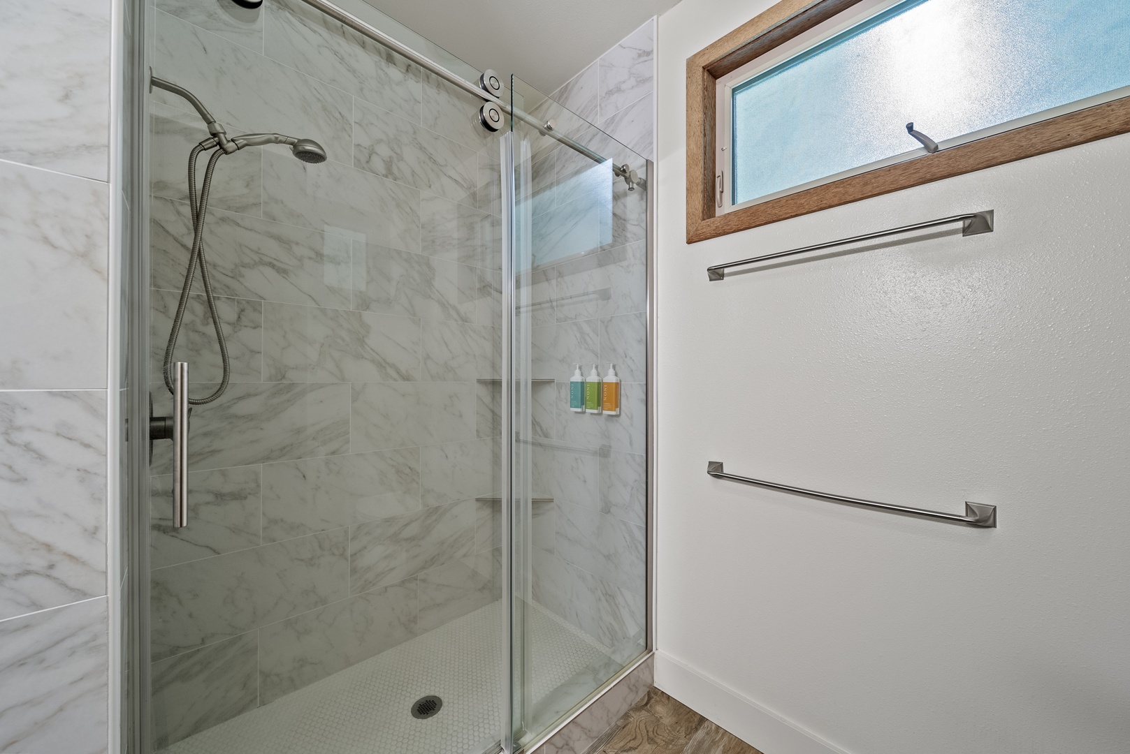 Haleiwa Vacation Rentals, Kaunala Retreat - Upgraded en suite bathroom with glass walk-in shower and accessibility-friendly grab bar.