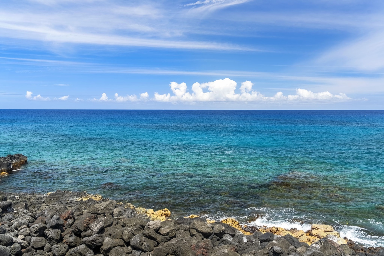 Kailua Kona Vacation Rentals, Sea Village 1105 - Crystal-clear turquoise waters and lava rock shoreline showcase the Kona Coast’s natural beauty.
