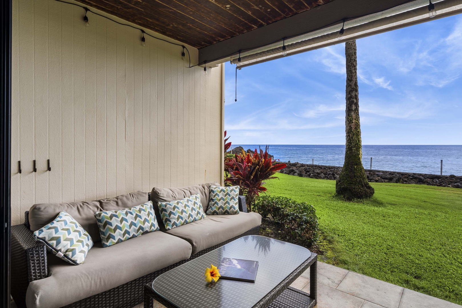 Kailua Kona Vacation Rentals, Keauhou Kona Surf & Racquet 2101 - The lanai area has a couch and a table on the left side