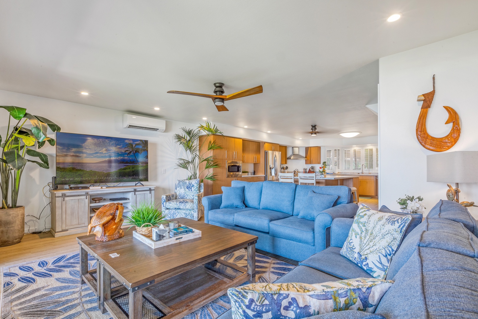 Lahaina Vacation Rentals, Puamana 254-2 - Lounge in the living room with plush sofas, split AC and large smart TV.