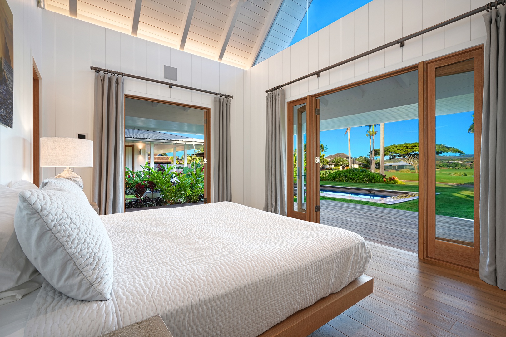 Koloa Vacation Rentals, Kaulu Hale at Kukuiula - The primary suite features a king-sized bed, central AC, ensuite bath, and direct access to the pool.