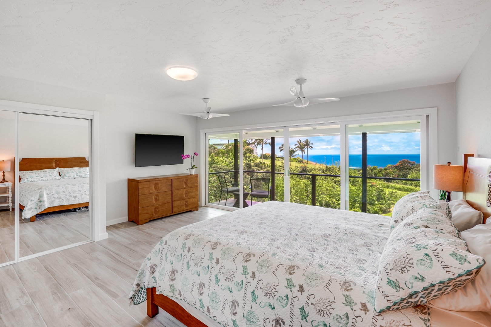Princeville Vacation Rentals, Wai Lani - Guest suite 2 with TV, a private lanai, and panoramic views