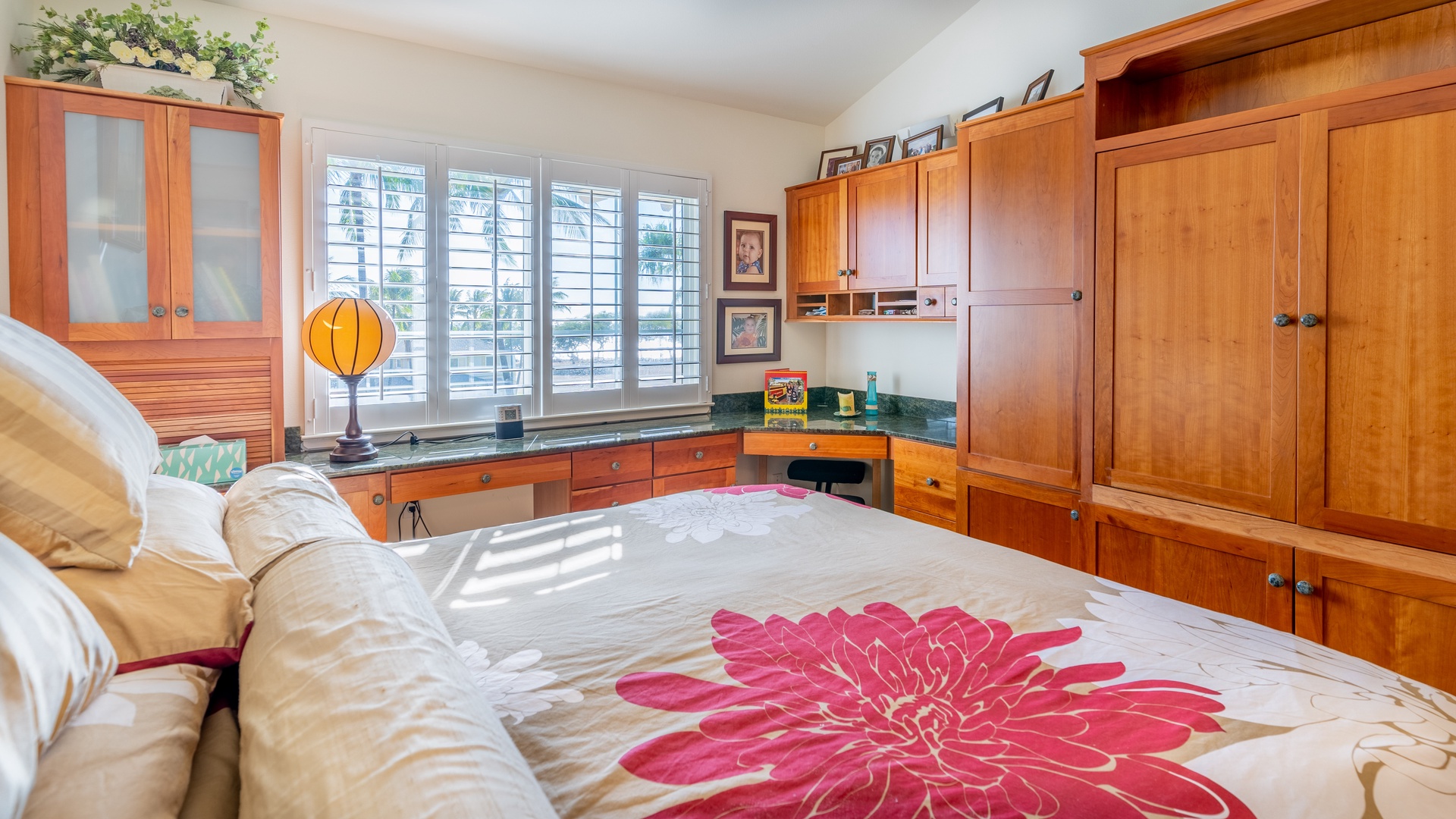 Kapolei Vacation Rentals, Kai Lani 16C - The primary guest bedroom includes a dresser and desk area.
