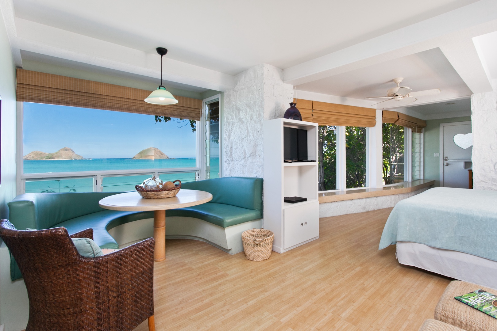 Kailua Vacation Rentals, Lanikai Village* - Hale Kainalu: Cozy primary suite breakfast nook with a built-in bench and stunning ocean views for a serene start to the day.