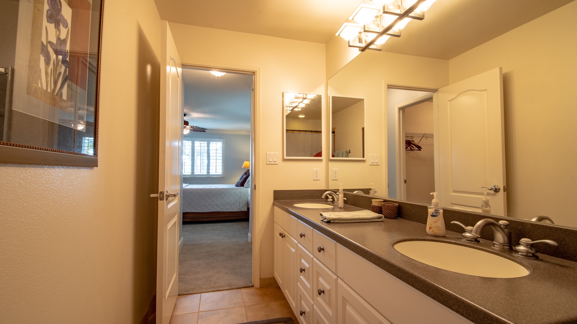 Kapolei Vacation Rentals, Ko Olina Kai 1047B - The primary guest bathroom featuring a shower and double vanity.