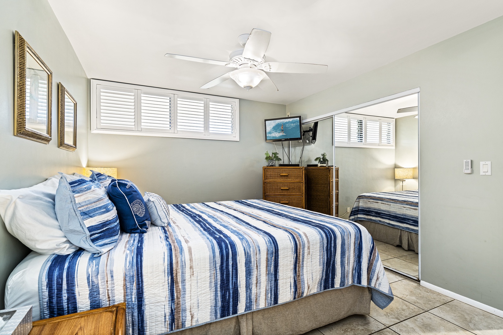 Kailua Kona Vacation Rentals, Sea Village 1105 - TV in the primary with ceiling fans to keep it cool