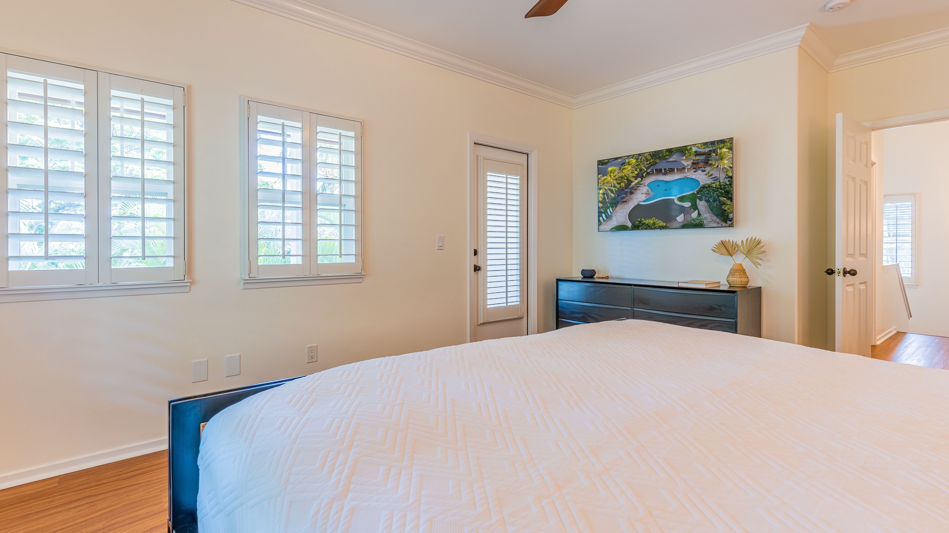 Kapolei Vacation Rentals, Coconut Plantation 1136-4 - The primary guest bedroom with a king bed and television.