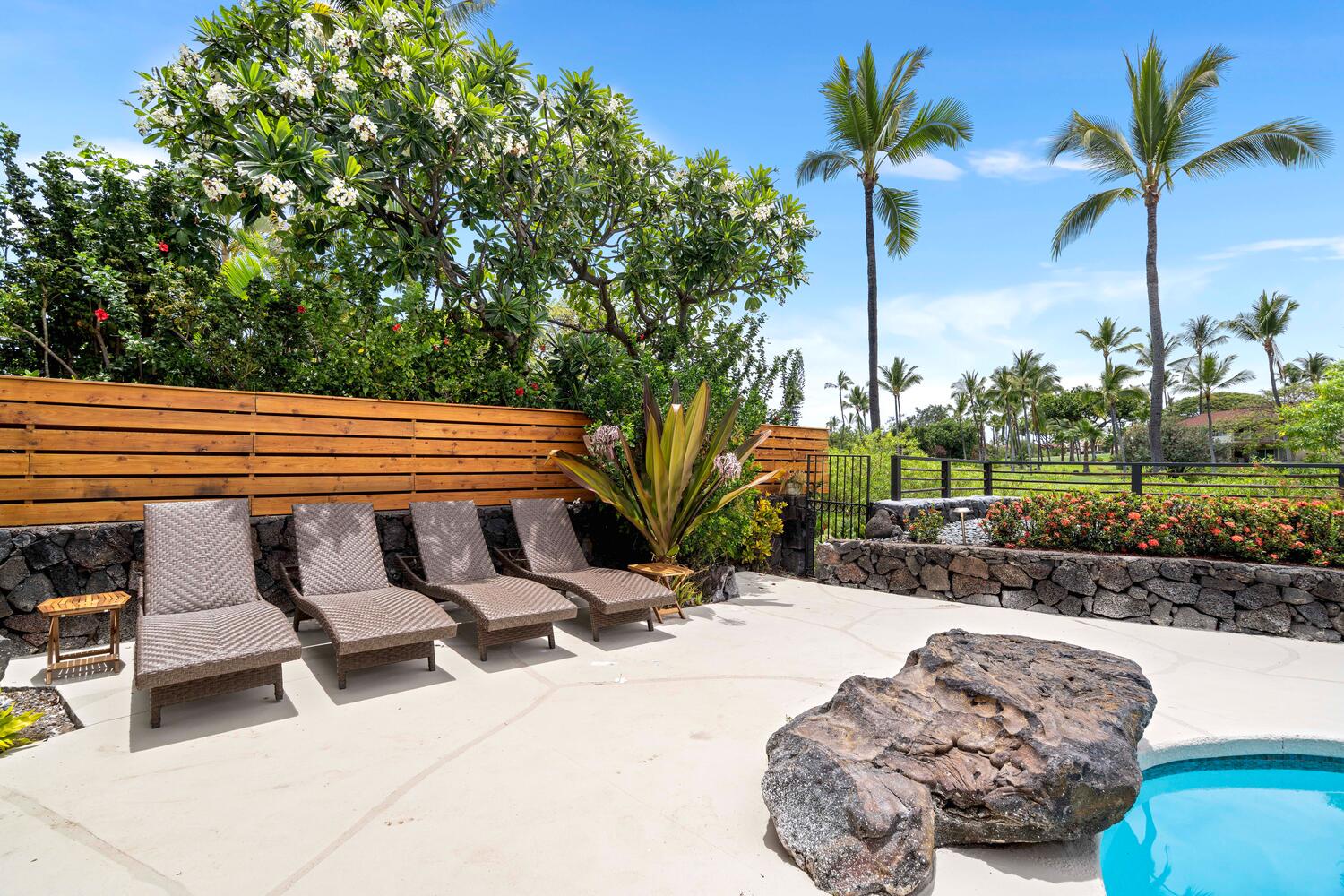 Kailua Kona Vacation Rentals, Manukai Hale - Chaise loungers are available poolside.