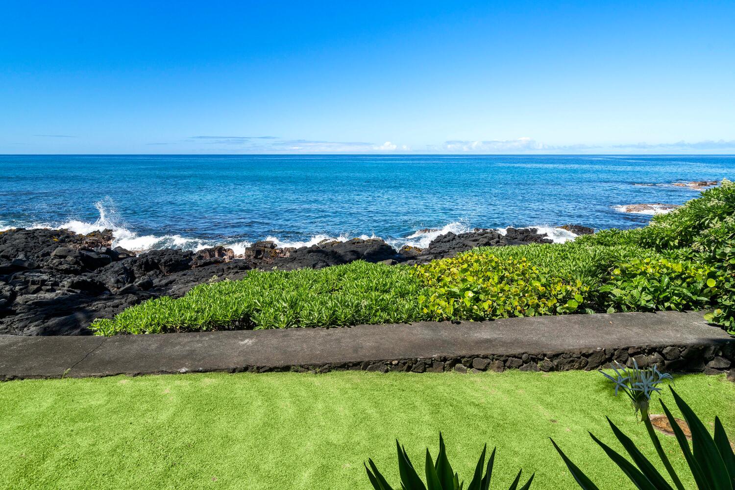 Kailua Kona Vacation Rentals, Hale Kai O'Kona #7 - Hale Kai O Kona #7 grounds with tropical landscaping and crashing waves.