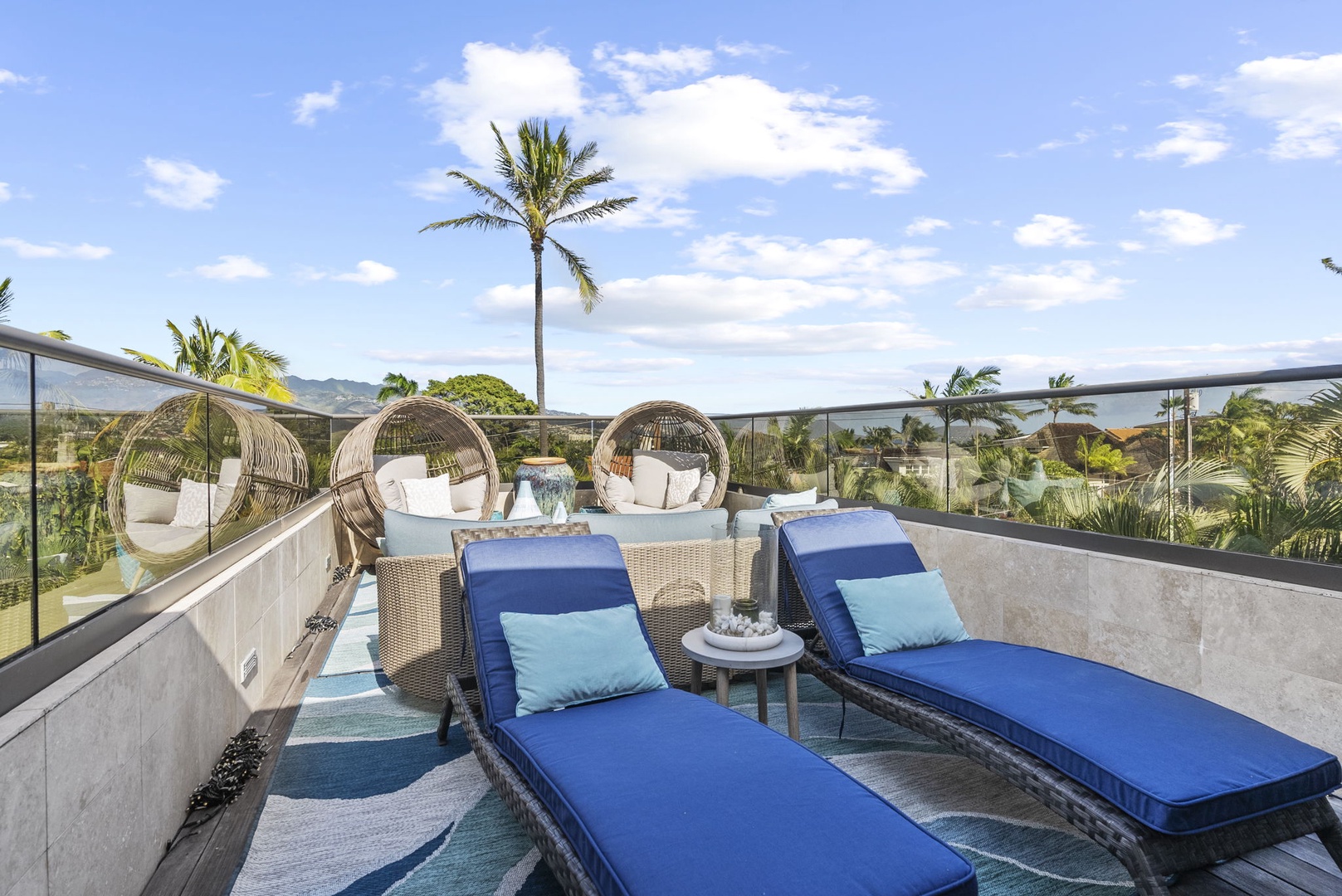 Honolulu Vacation Rentals, Pili Pono - Outdoor lounge chairs on a rooftop deck overlooking the scenery.