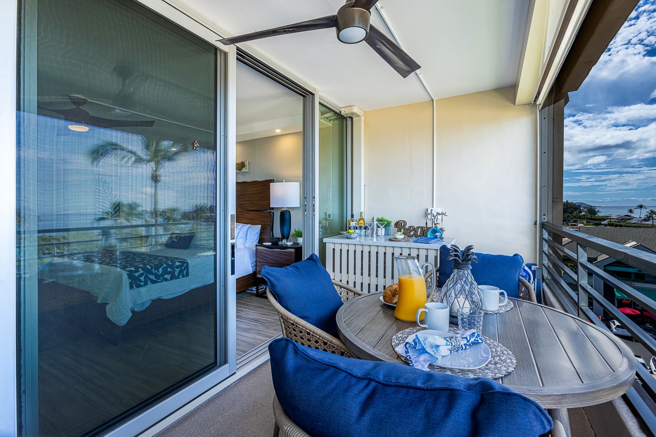 Kihei Vacation Rentals, Kamaole Beach Royal 610 - Step from the primary suite straight onto the lanai, the built-in bar counter just an arm's reach away.