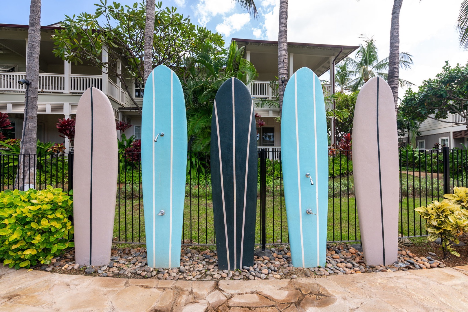 Kapolei Vacation Rentals, Coconut Plantation 1080-4 - A surfboard fence sets the tone before you even reach the water.