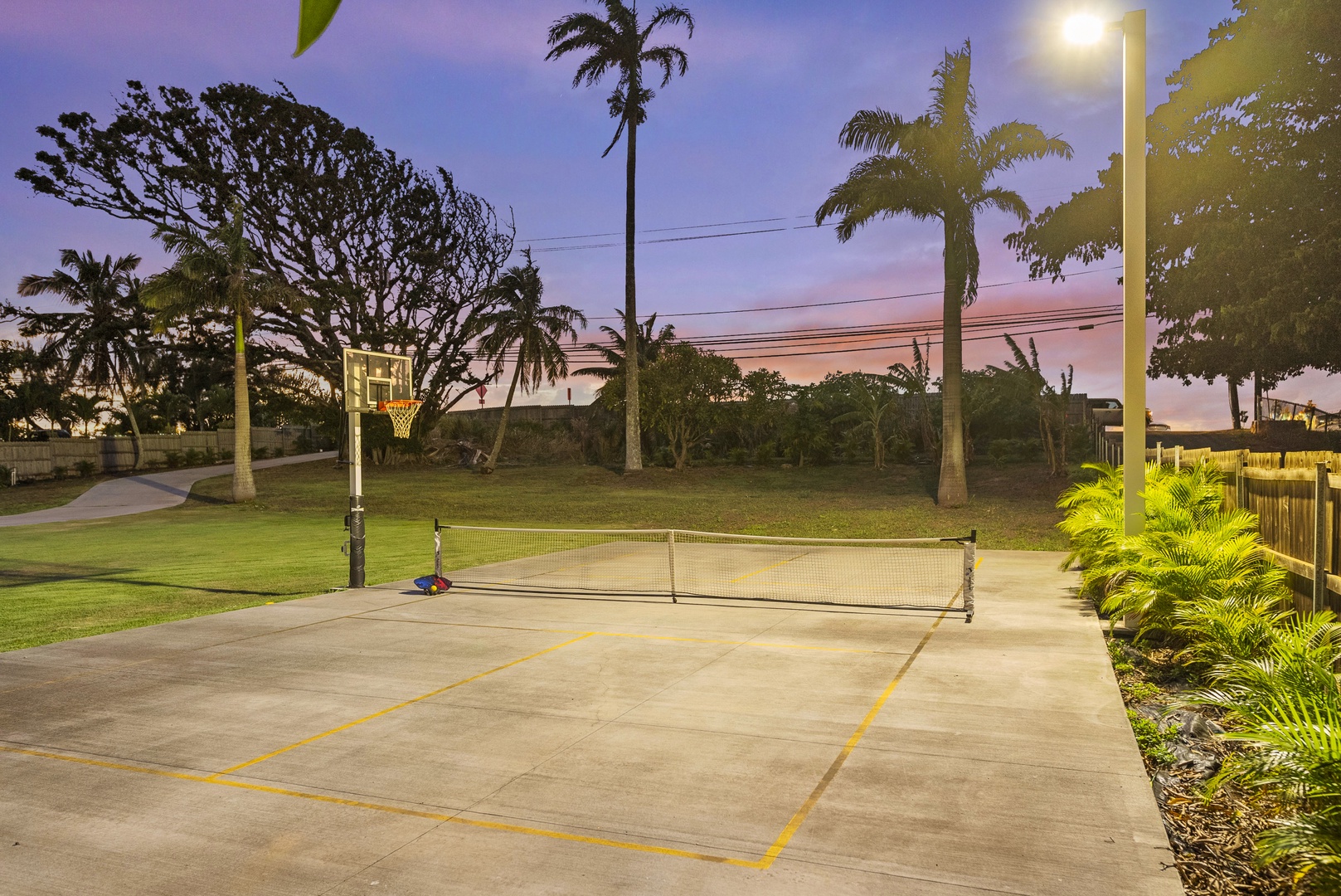 Haleiwa Vacation Rentals, Sunset Pickleball Paradise - Multi-use court featuring basketball and pickleball setups ensures hours of fun and active play for guests.