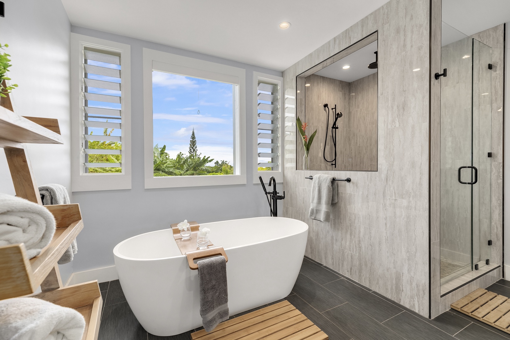 Haleiwa Vacation Rentals, Hale Mahina - Primary bath with soaking tub, custom shower and views of the greenery outdoors.