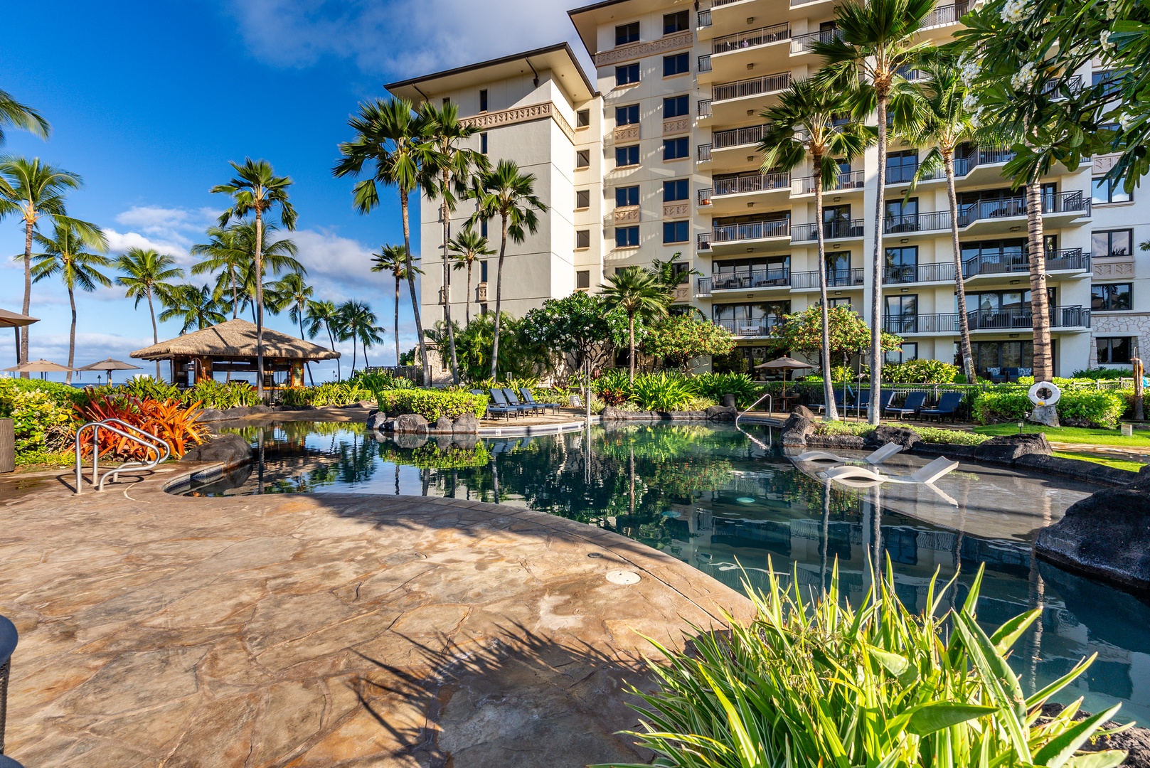 Cool off under the cabana between laps in the garden pool.