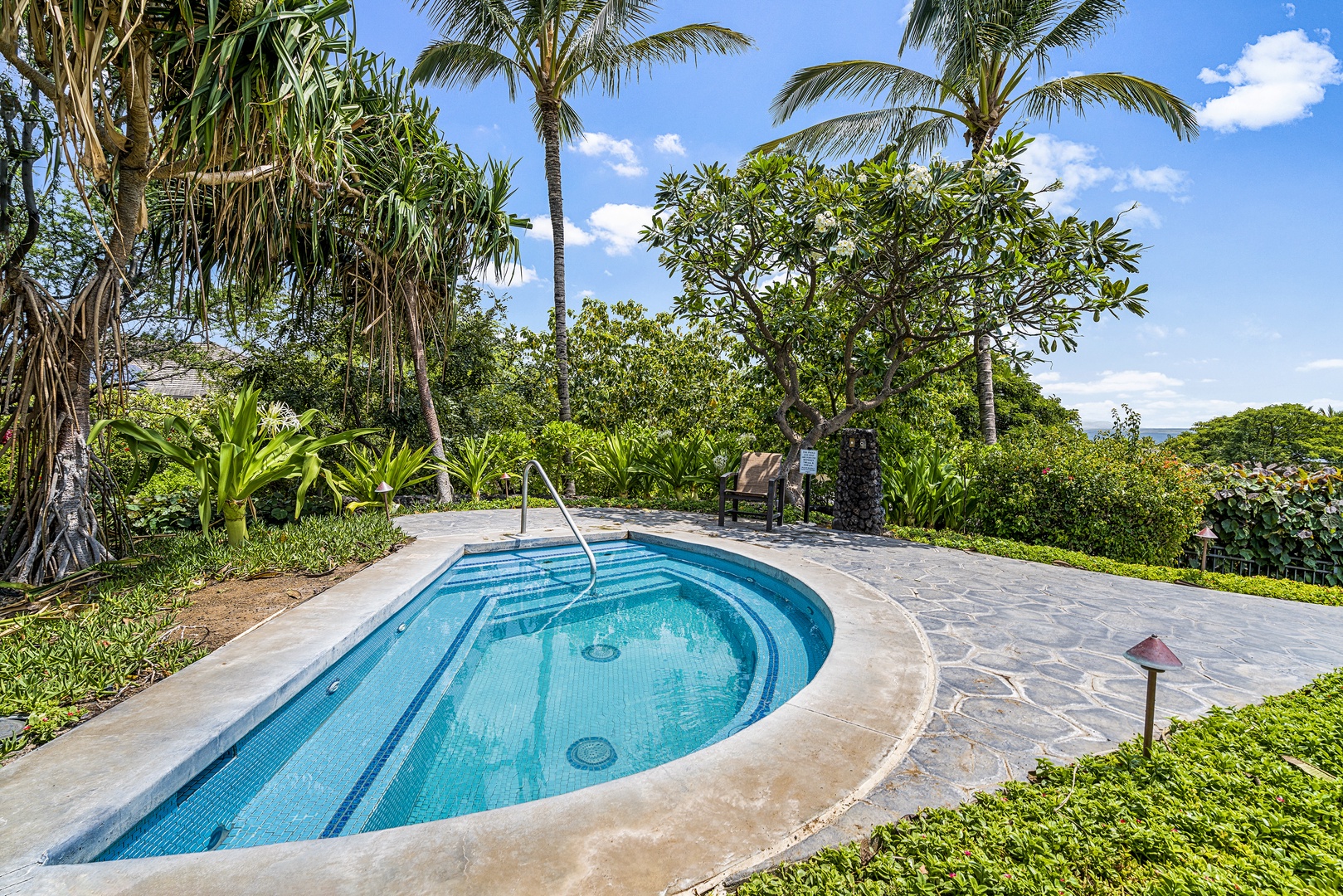 Kamuela Vacation Rentals, Mauna Lani KaMilo #503 - Soak in soothing warmth surrounded by vibrant foliage—a perfect end to a day of exploration or beach time.