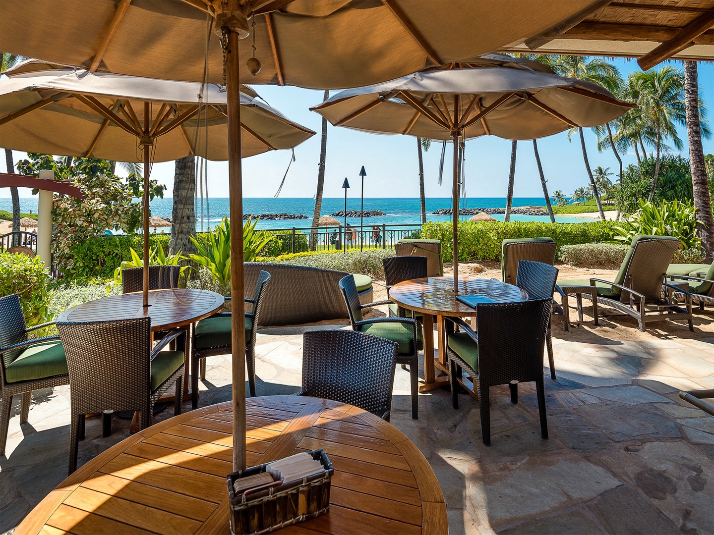 Kapolei Vacation Rentals, Ko Olina Beach Villas O603 - Outdoor dining at the resort and an ocean full of daydreams.