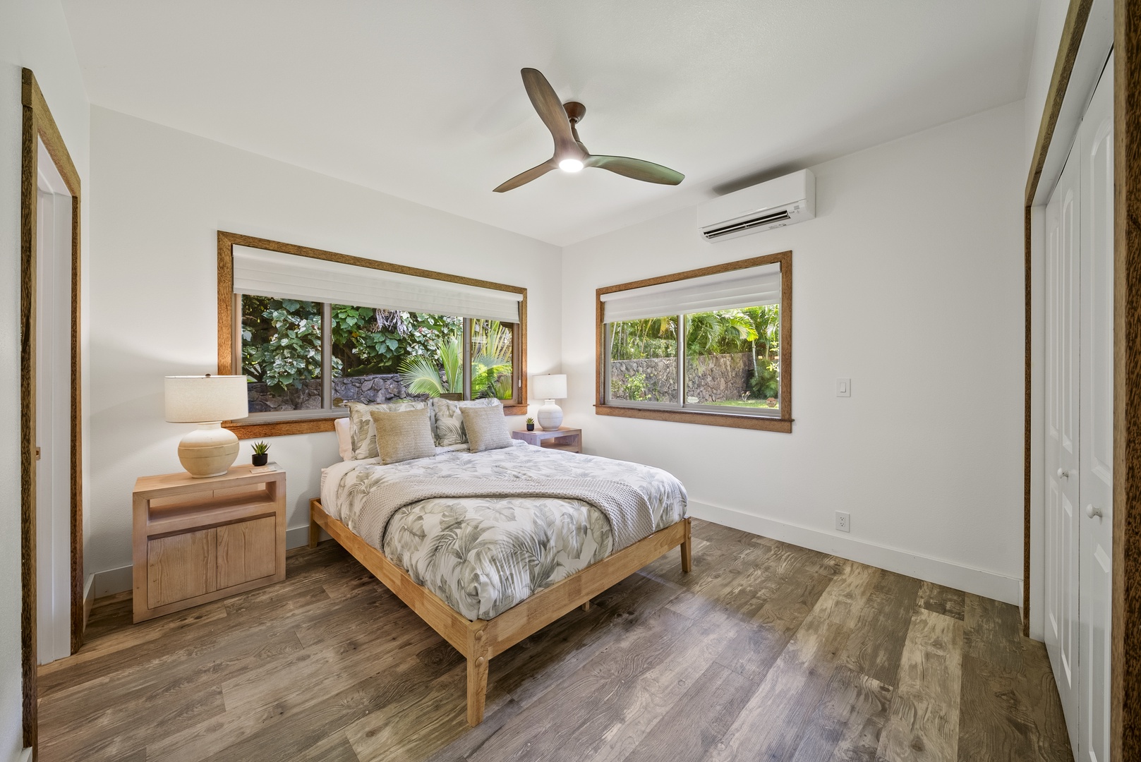 Haleiwa Vacation Rentals, Kaunala Retreat - Guest bedroom with queen bed, A/C, and large windows letting in natural North Shore light.