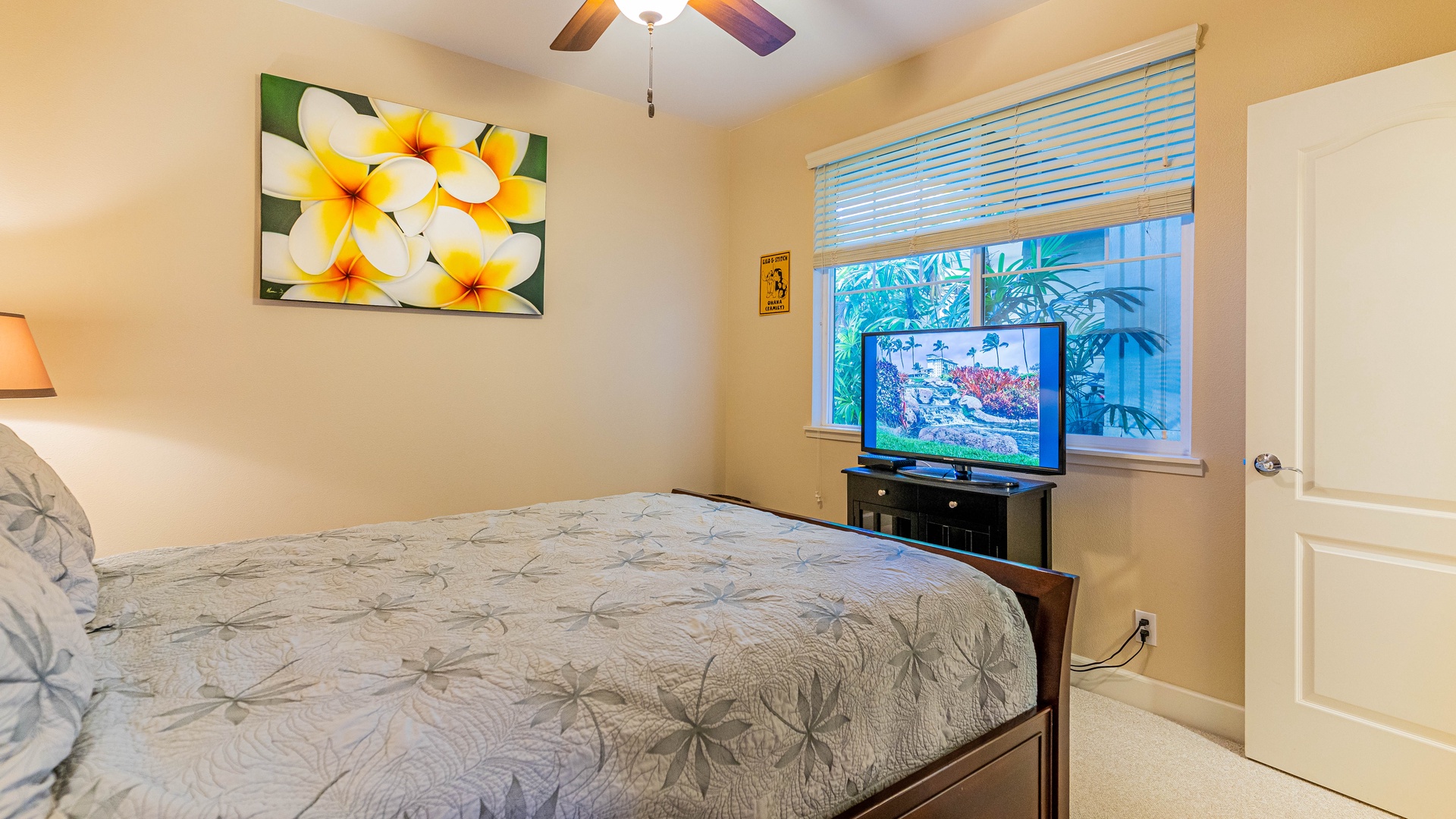 Kapolei Vacation Rentals, Ko Olina Kai 1033C - The downstairs bedroom offers a queen bed and TV.