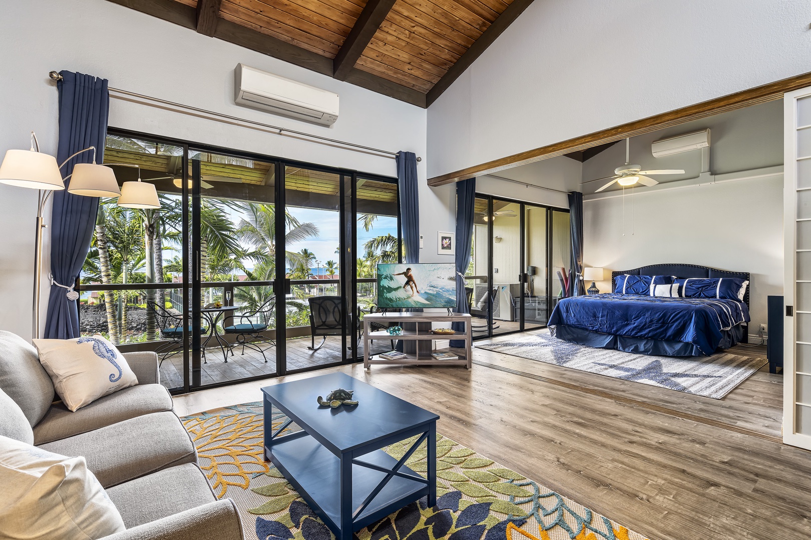 Kailua Kona Vacation Rentals, Keauhou Kona Surf & Racquet 9303 - Living room looking towards the primary bedroom with sliding doors