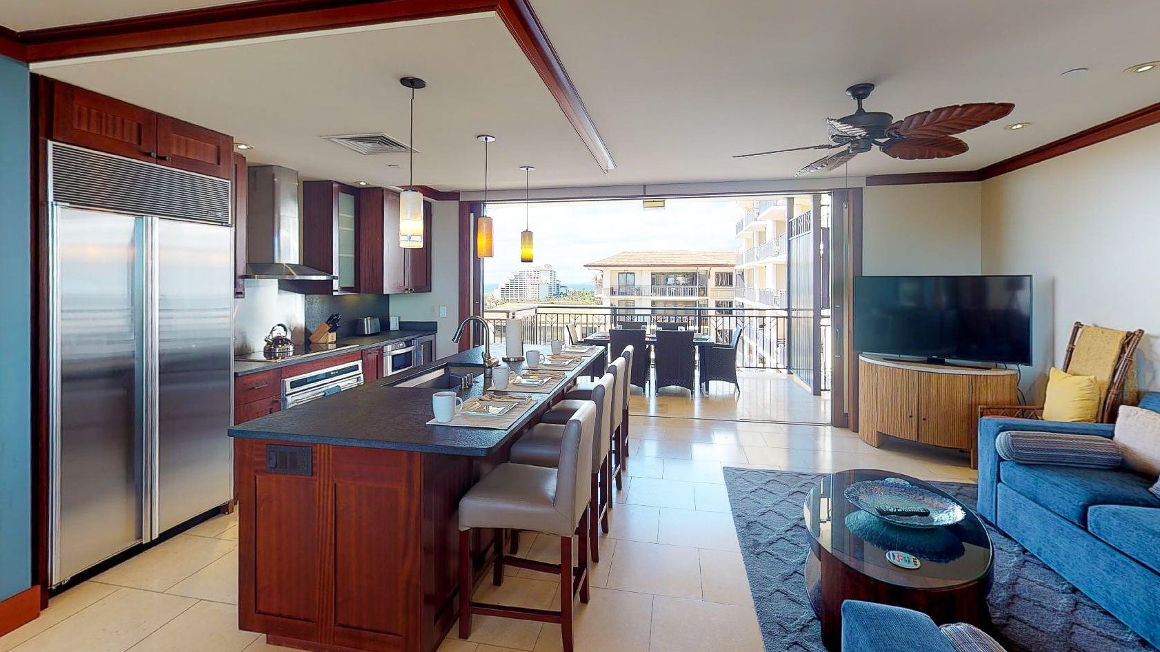 Kapolei Vacation Rentals, Ko Olina Beach Villas O1121 - The stylish kitchen looking out to one of two lanai areas.