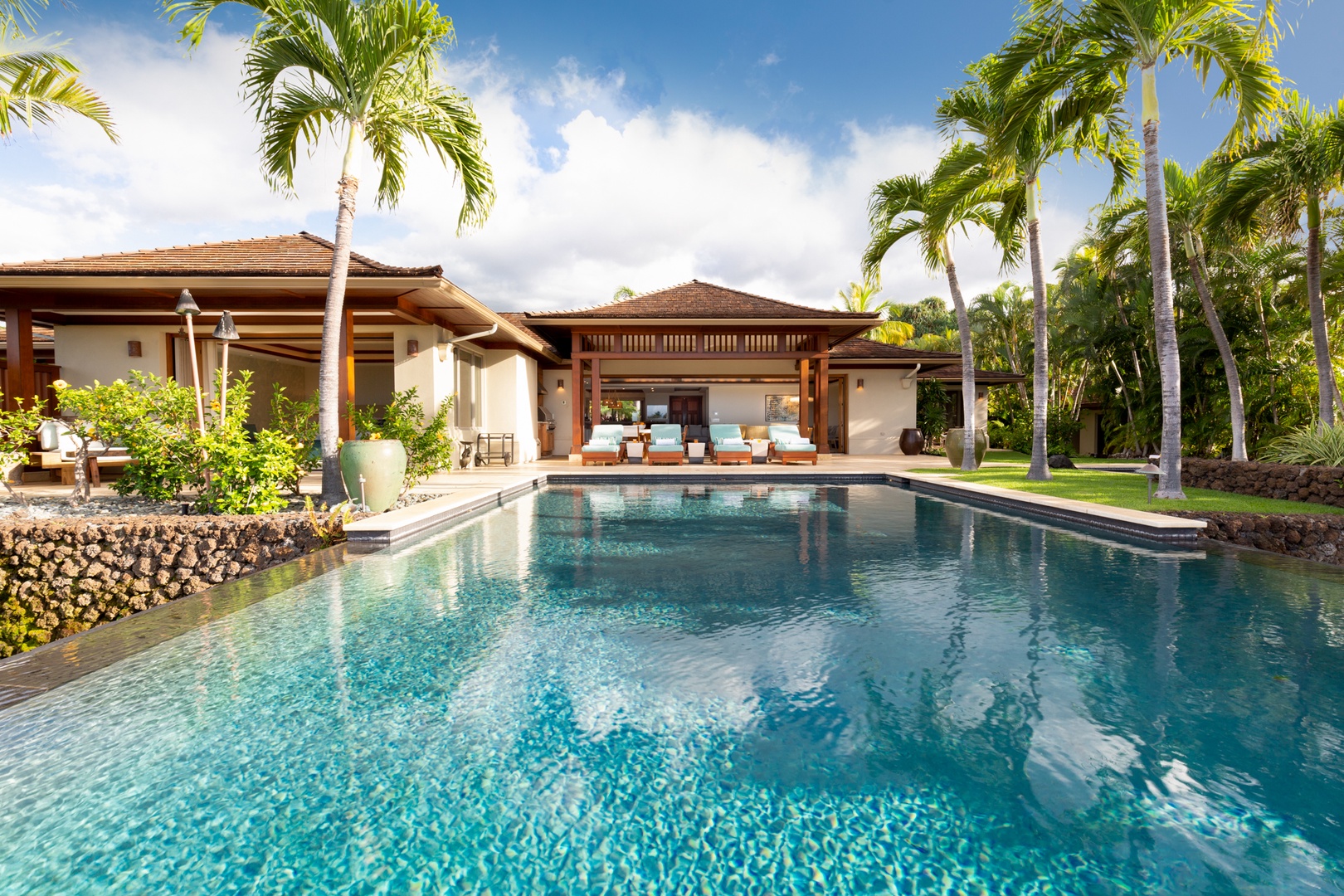 Kailua Kona Vacation Rentals, 4BD Hainoa Estate (102) at Four Seasons Resort at Hualalai - Looking back to the lanai & private yard from the pool