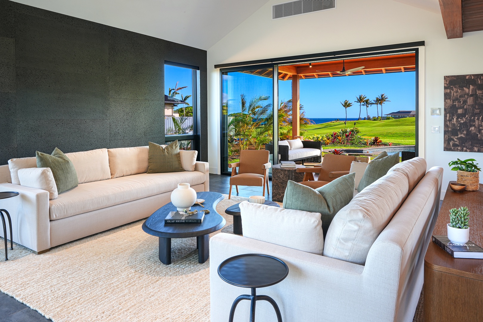 Koloa Vacation Rentals, Hale Hanohano - Main living room with retractable glass walls and soft natural light.
