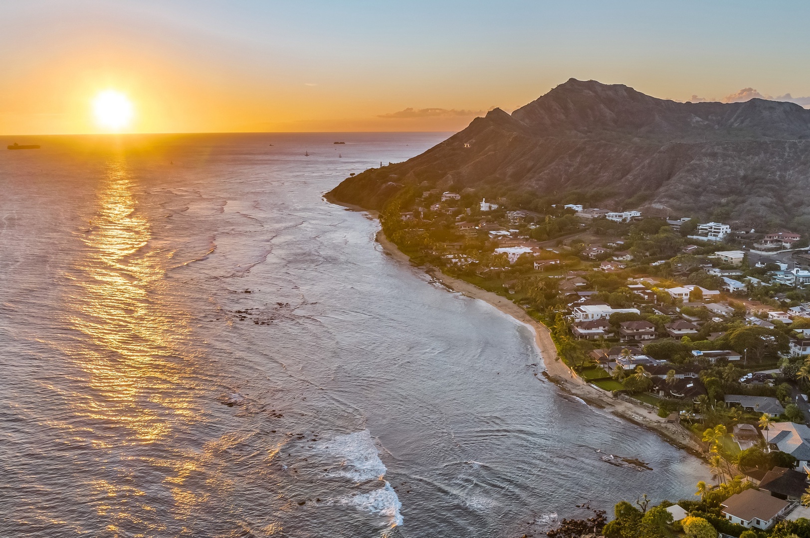 Honolulu Vacation Rentals, Diamond Head Grand Escape - End each day with a breathtaking sunset over Diamond Head, painting the coastline in golden light.