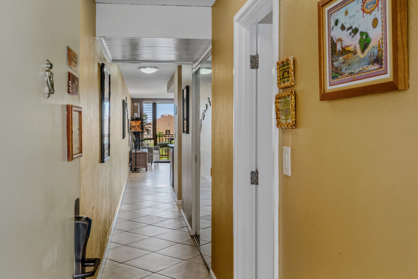 Kihei Vacation Rentals, Kamaole Sands 5310 - Step through the front door and the whole unit opens up straight ahead, lanai visible at the far end.