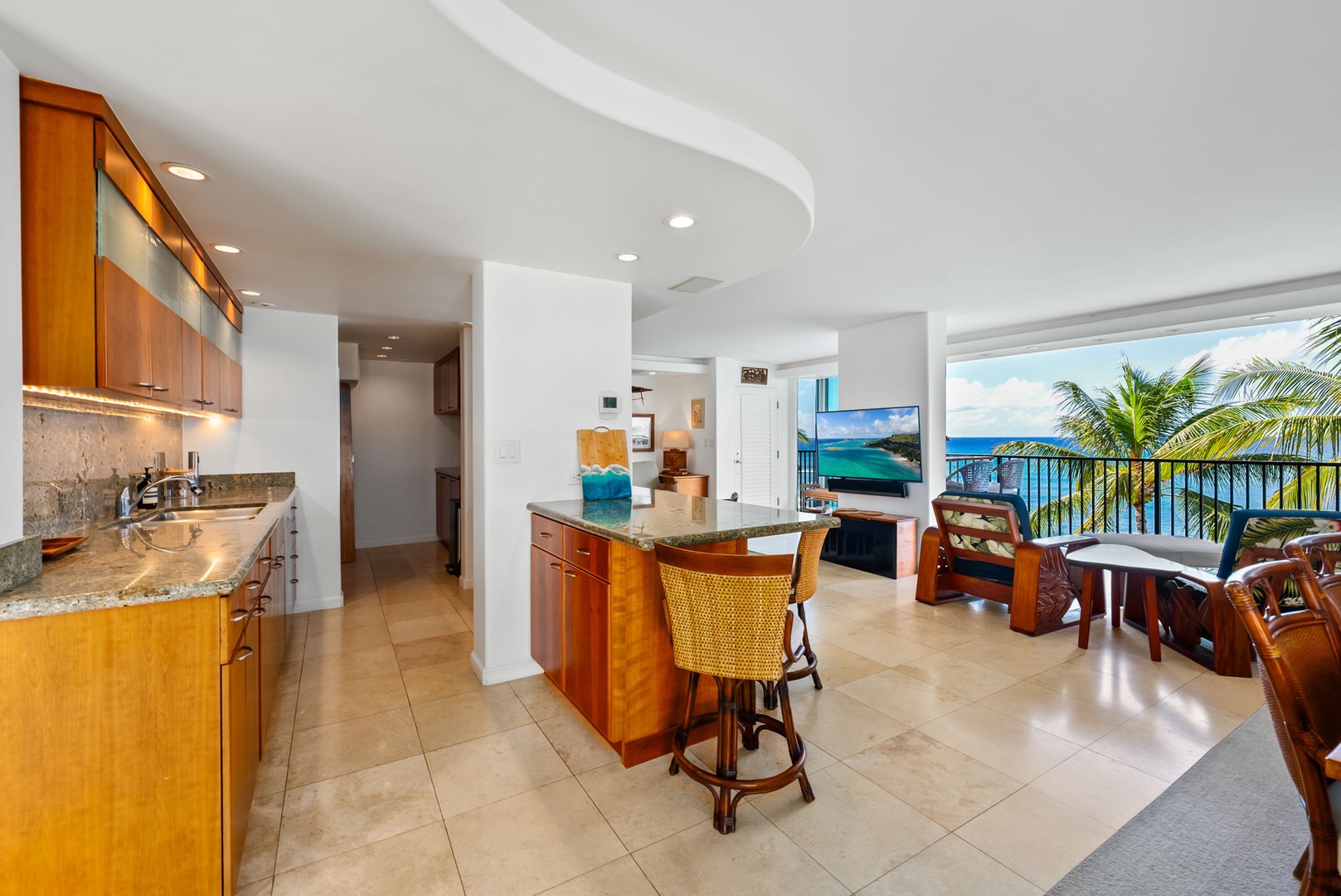 Honolulu Vacation Rentals, Kaimana Views - Open kitchen and dining area with ocean views, perfect for preparing and enjoying meals in a relaxing island atmosphere