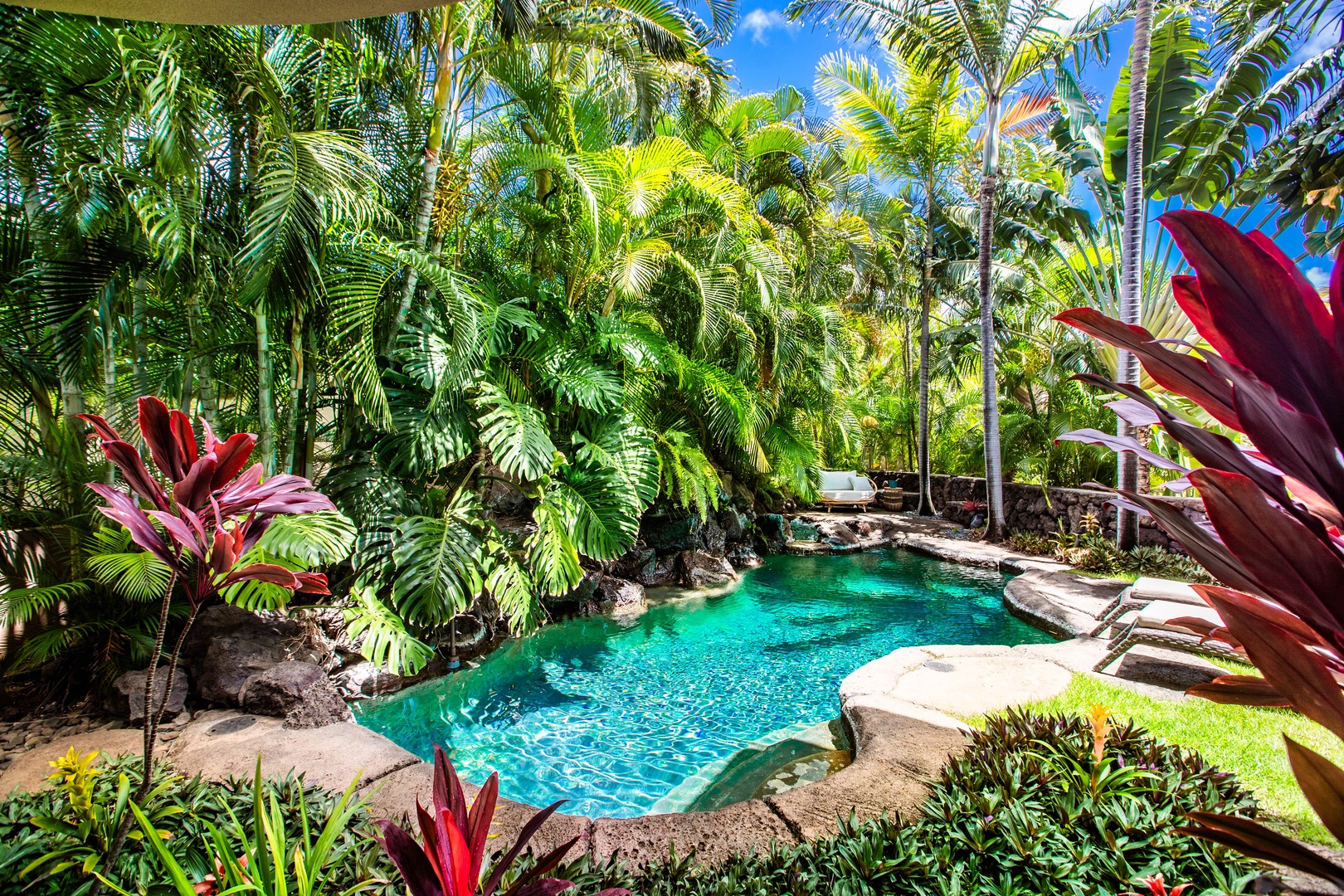 Honolulu Vacation Rentals, Pili Pono - Lush tropical garden surrounds a serene pool for ultimate outdoor relaxation.