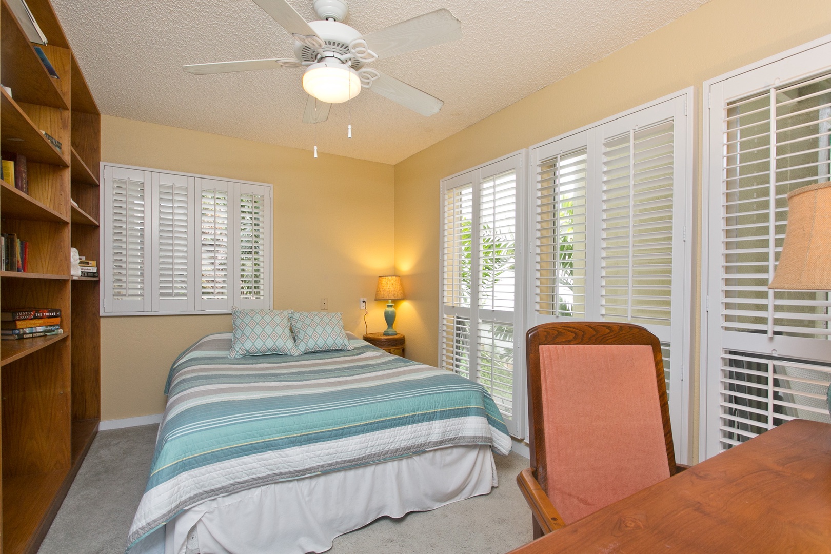 Kailua Vacation Rentals, Hale Kolea* - Guest bedroom 4 with a queen bed, desk area and natural lighting.