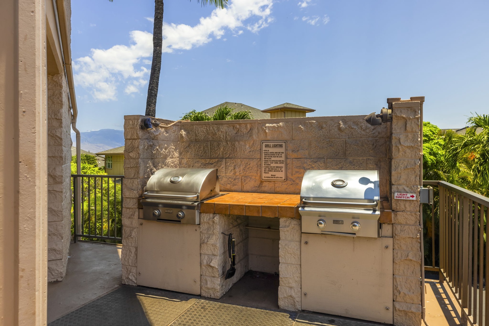 Kihei Vacation Rentals, Kihei Alii Kai C206 - Fire up the shared grills for dinner, the mountains rising past the palms behind.