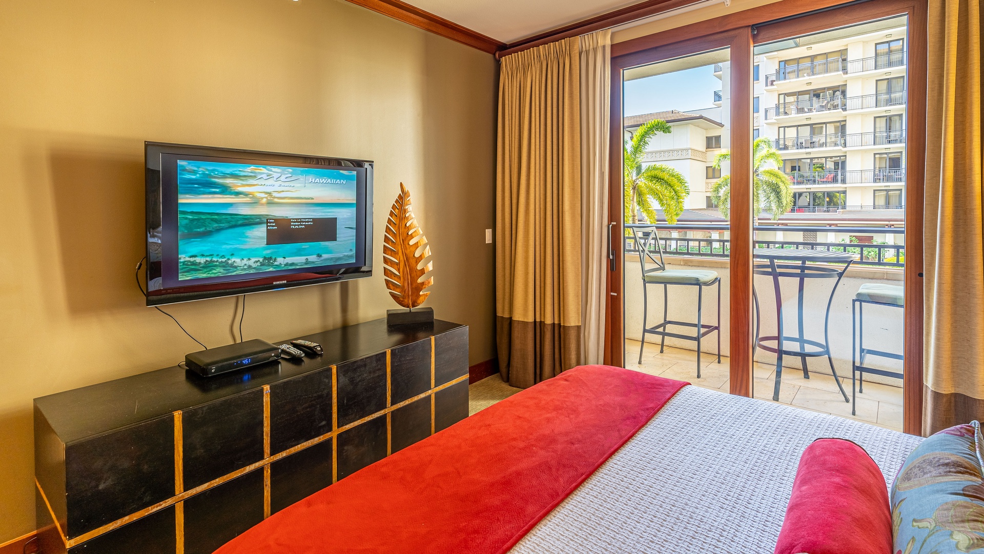 Kapolei Vacation Rentals, Ko Olina Beach Villas O224 - The primary guest bedroom with a dresser and TV.