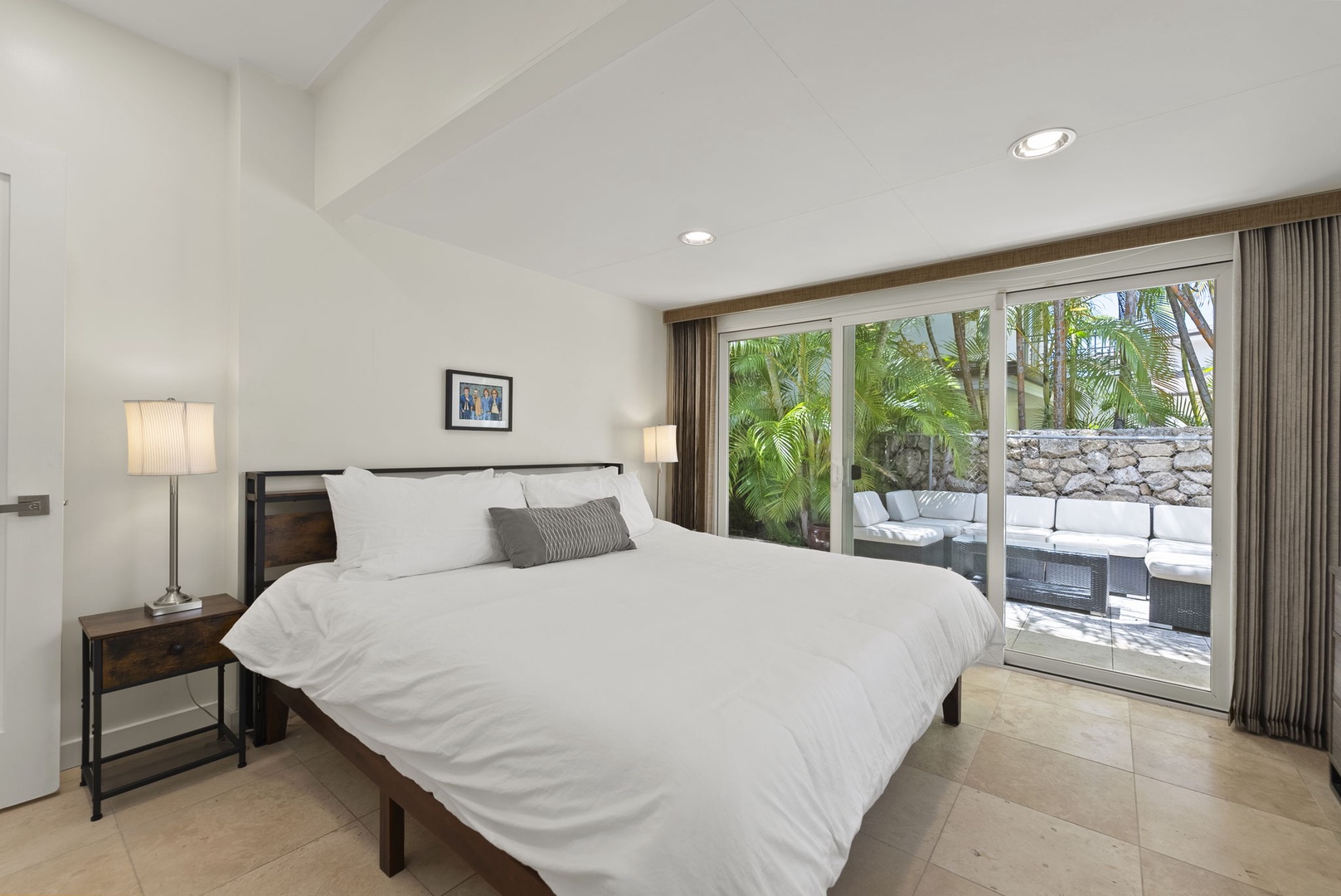 Honolulu Vacation Rentals, Kahala Lani - Guest room with direct pool access—step outside and enjoy the island sunshine.